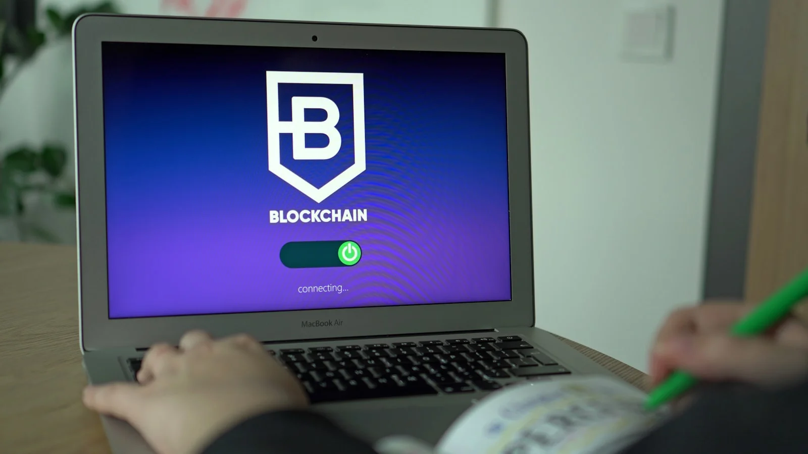 Learner studying blockchain concepts on a laptop